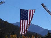 A thumb nail view of Grand Lake, Colorado during Constitution Week in September looking at the large Garrison Flag that hangs over Grand Ave. on parade day; click here to open a window with a larger picture.